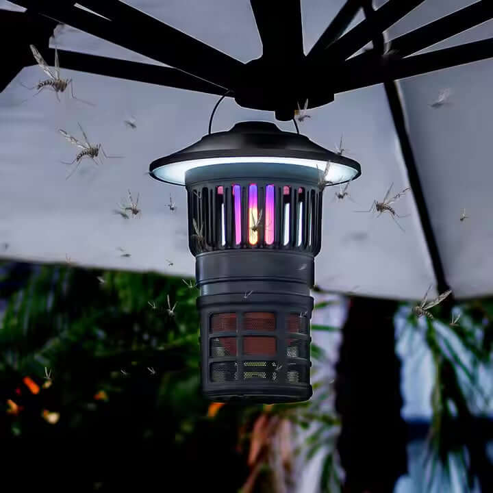 Tornado Mosquito Killer Lantern hanging under umbrella, effectively capturing mosquitoes in outdoor setting.